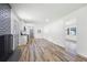Open concept living room with brick fireplace, kitchen, and dining area at 4172 N Martin Way, Lithia Springs, GA 30122