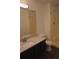 Bathroom featuring a shower and a sink with a granite countertop and dark wood cabinets at 60 Parkman Trl, Covington, GA 30016