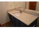 Bathroom featuring a sink with a granite countertop and dark wood cabinets at 60 Parkman Trl, Covington, GA 30016