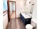 Bathroom features a granite countertop vanity and luxury vinyl flooring at 60 Parkman Trl, Covington, GA 30016