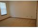 A bright bedroom offers neutral carpet, natural light, and ample space, creating a calm and inviting space at 60 Parkman Trl, Covington, GA 30016