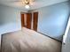 Bedroom with neutral carpet, ceiling fan and natural light at 60 Parkman Trl, Covington, GA 30016