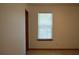 A peaceful bedroom features neutral carpet and a bright window, perfect for relaxation and rest at 60 Parkman Trl, Covington, GA 30016