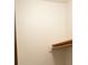 A tidy closet featuring wooden shelving and ample storage space to keep belongings organized at 60 Parkman Trl, Covington, GA 30016