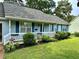 Lovely single story home showcasing beautiful curb appeal and manicured lawn at 60 Parkman Trl, Covington, GA 30016
