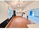 Bright kitchen features white cabinets, an eat-in area, and lots of natural light at 60 Parkman Trl, Covington, GA 30016