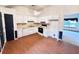 Functional eat-in kitchen featuring white cabinets and modern appliances at 60 Parkman Trl, Covington, GA 30016