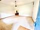 Spacious living room with neutral carpet, ceiling fan, and ample natural light at 60 Parkman Trl, Covington, GA 30016