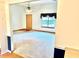 Bright and airy living room with neutral carpet, large window, and open layout at 60 Parkman Trl, Covington, GA 30016