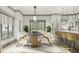 Bright dining area adjacent to the kitchen, featuring a modern light fixture and backyard views at 0 Paige St, Dallas, GA 30157