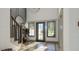 Bright entryway featuring a stylish chandelier, hardwood floors, and a staircase with a dark wood banister at 0 Paige St, Dallas, GA 30157