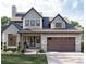 Charming two-story home featuring a brick facade, gray siding, a covered porch, and a two-car garage at 0 Paige St, Dallas, GA 30157