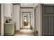 Hallway with views into multiple rooms, wood-look floors, and neutral trim at 0 Paige St, Dallas, GA 30157