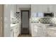 Contemporary kitchen with white cabinets, a tile backsplash, stainless steel appliances, and an island at 0 Paige St, Dallas, GA 30157