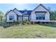 Beautiful single Gathering home with verdant lawn and landscaping at 2750 Herrington Dr, Cumming, GA 30041