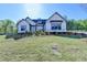 Beautiful single Gathering home with verdant lawn and landscaping at 2750 Herrington Dr, Cumming, GA 30041