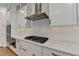 Gourmet kitchen features a gas cooktop, stainless vent hood, and double ovens at 2750 Herrington Dr, Cumming, GA 30041