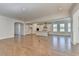 Open concept living room and kitchen with hardwood floors and lots of natural light at 2750 Herrington Dr, Cumming, GA 30041