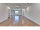 Open-concept living room with hardwood floors, recessed lighting, and a large window at 2750 Herrington Dr, Cumming, GA 30041