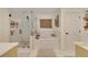 Modern bathroom showcasing white subway tile, a glass shower, and a soaking tub at 3215 Woodview Se Dr, Smyrna, GA 30082