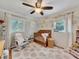 Charming Bedroom with soft decor, a crib, and a cozy rocking chair at 3215 Woodview Se Dr, Smyrna, GA 30082