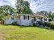 Charming single-Gathering home with a well-manicured front lawn and white painted brick at 3215 Woodview Se Dr, Smyrna, GA 30082