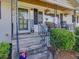 Welcoming front porch with decorative railing and potted plants at 3215 Woodview Se Dr, Smyrna, GA 30082