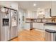 Bright kitchen with stainless steel fridge and white cabinets, perfect for modern living at 3215 Woodview Se Dr, Smyrna, GA 30082