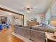 Open-concept living space with hardwood floors, a comfortable sofa, and stylish furnishings at 3215 Woodview Se Dr, Smyrna, GA 30082