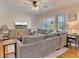 Cozy living room featuring a large sectional sofa and stylish decor at 3215 Woodview Se Dr, Smyrna, GA 30082