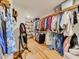 Organized walk-in closet with ample hanging space and shelving for clothes and shoes at 3215 Woodview Se Dr, Smyrna, GA 30082