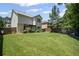 Beautifully landscaped backyard featuring an expansive lawn and privacy fence at 5575 Hedge Brook Dr, Cumming, GA 30028