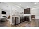 Open kitchen design with bar seating, stainless steel appliances, and seamless access to living area at 5575 Hedge Brook Dr, Cumming, GA 30028