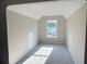 Finished attic space with carpet, storage, and natural light at 7097 Cavender Sw Dr, Atlanta, GA 30331