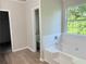 Bathroom with soaking tub and tile surround at 7097 Cavender Sw Dr, Atlanta, GA 30331