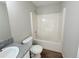Bathroom featuring a shower-tub combo and granite vanity top at 7097 Cavender Sw Dr, Atlanta, GA 30331