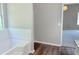 Bright bathroom featuring a soaking tub, wood-look floors and natural light at 7097 Cavender Sw Dr, Atlanta, GA 30331