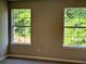 Bedroom windows letting in natural light and green backyard views at 7097 Cavender Sw Dr, Atlanta, GA 30331