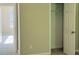 Neutral bedroom with closet and doorway to another room, carpeted at 7097 Cavender Sw Dr, Atlanta, GA 30331