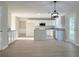 Modern kitchen featuring white cabinets, stainless appliances, and a breakfast bar at 7097 Cavender Sw Dr, Atlanta, GA 30331