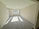 Bright living room with carpeted floor and lots of sunlight at 7097 Cavender Sw Dr, Atlanta, GA 30331