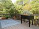 Spacious back deck with decorative blue rug and view of surrounding trees at 21 Devin Lane Ln, Euharlee, GA 30145