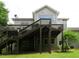 Exterior view of home with a multi-level deck, gray siding, and a well-maintained lawn at 21 Devin Lane Ln, Euharlee, GA 30145