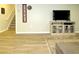 Finished basement featuring wood-look flooring, a neutral wall color, and entertainment center at 21 Devin Lane Ln, Euharlee, GA 30145