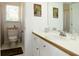 Bathroom featuring white cabinets, a white countertop, and a decorative mirror at 21 Devin Lane Ln, Euharlee, GA 30145