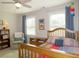 Bedroom featuring natural light, a wood-framed bed, chair, and neutral decor at 21 Devin Lane Ln, Euharlee, GA 30145