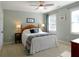 Comfortable bedroom with a ceiling fan, natural light, and warm, inviting decor at 21 Devin Lane Ln, Euharlee, GA 30145