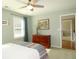 Bedroom featuring a dresser, ceiling fan, natural light, and neutral wall color at 21 Devin Lane Ln, Euharlee, GA 30145