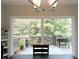 Dining area overlooking a spacious deck and lush greenery, creating a serene and inviting atmosphere at 21 Devin Lane Ln, Euharlee, GA 30145