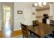 Elegant dining area with a view to the kitchen, featuring a stylish light fixture and ample space for Gathering gatherings at 21 Devin Lane Ln, Euharlee, GA 30145
